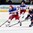MINSK, BELARUS - MAY 12: Russia's Viktor Tikhonov #10 skates with the puck while USA's Jeff Petry #2 defends during preliminary round action at the 2014 IIHF Ice Hockey World Championship. (Photo by Andre Ringuette/HHOF-IIHF Images)

